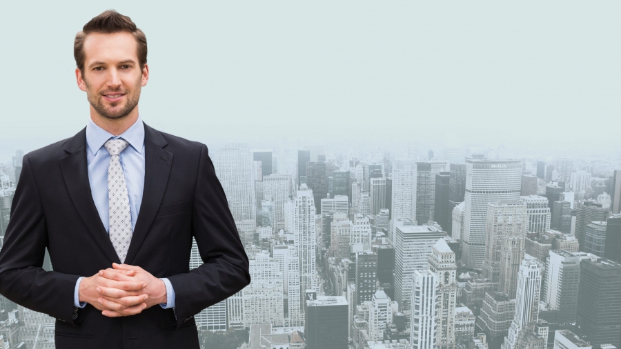 Digital composite image of businessman standing with hands clasped against cityscape